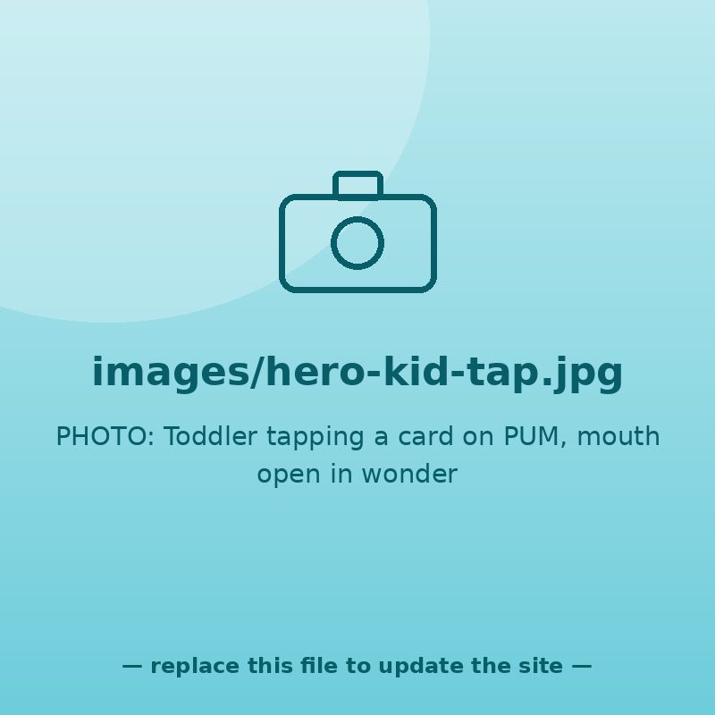 Toddler tapping a card on PUM, mouth open in wonder